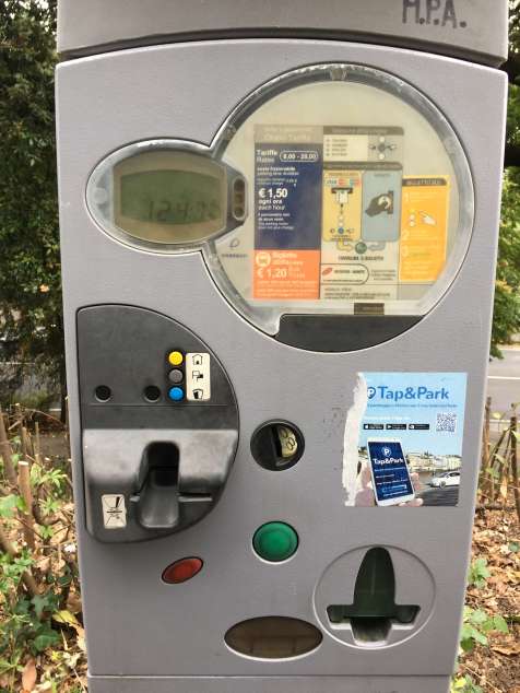 Parking kiosk take coins and cards.